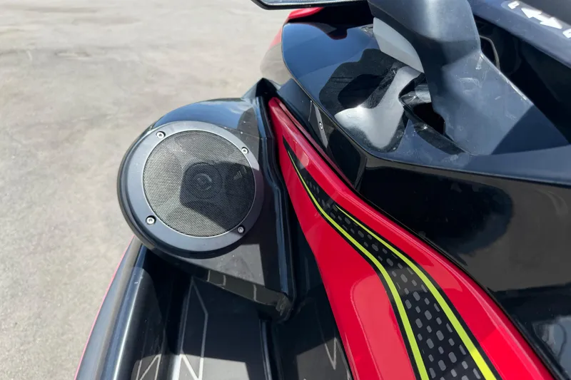 Slide: The Image of 2024 Kawasaki Jetski STX 160LX speaker detail with vibrant red and black design. - 21