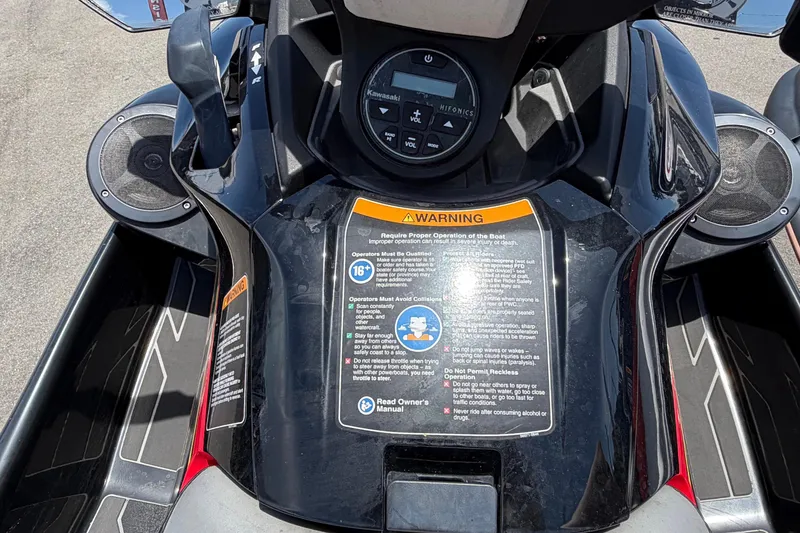 Slide: The Image of Close-up of the control area of a Kawasaki Jetski STX 160LX with warning labels. - 13