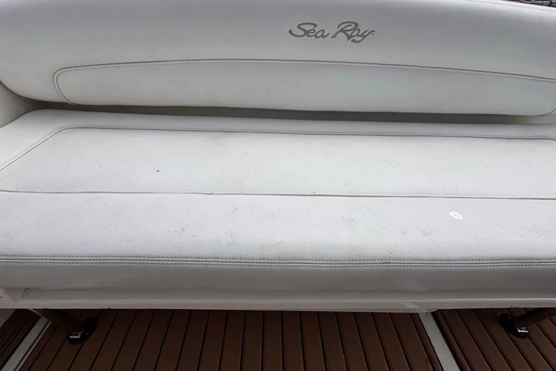 Slide: The Image of White leather seating on a 2005 Sea Ray 300 Sundancer boat. - 36