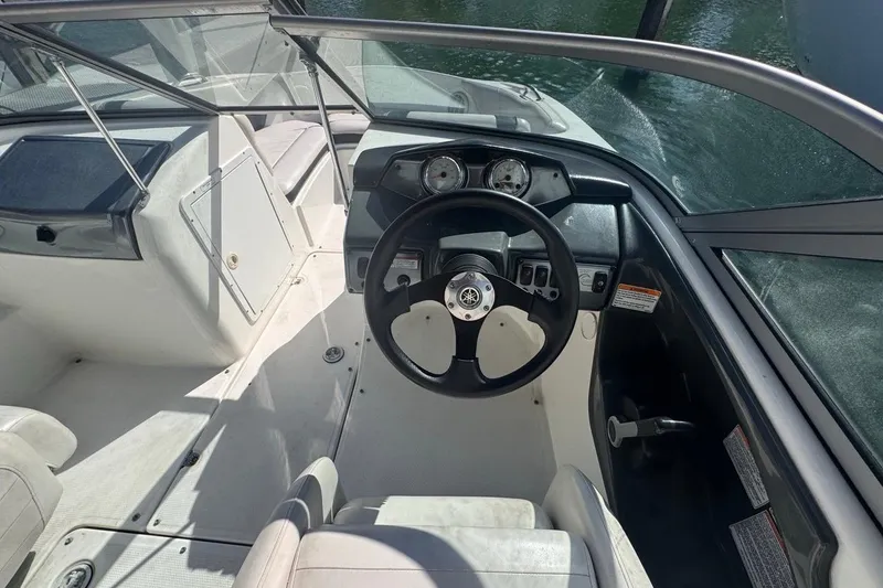 Slide: The Image of 2012 Yamaha Boats SX190 cockpit with steering wheel and dashboard controls. - 19