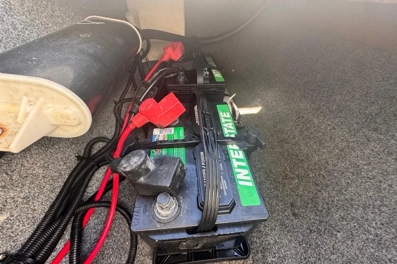 Slide: The Image of Battery compartment of a 2012 Yamaha Boats SX190 with Interstate batteries and wiring. - 34
