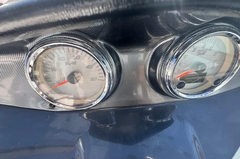 Slide: The Image of Dashboard of 2012 Yamaha Boats SX190 showing speedometer and tachometer. - 22