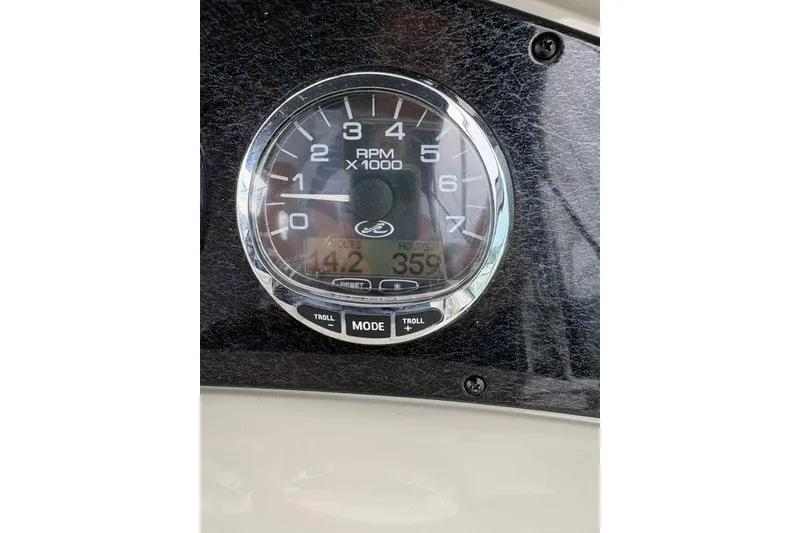 Slide: The Image of Tachometer of 2013 Sea Ray 240 Sundancer showing RPM and engine hours. - 18