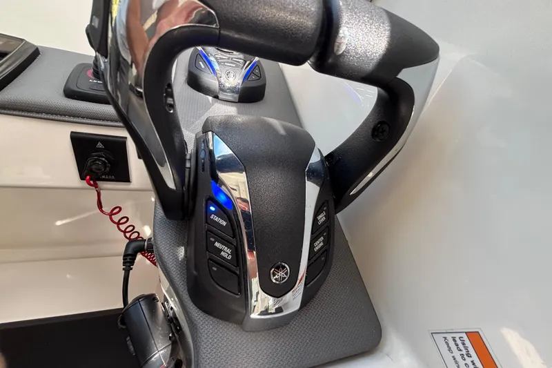 Slide: The Image of Close-up of 2024 Pursuit OS 445 Offshore boat controls with Yamaha throttle system. - 85