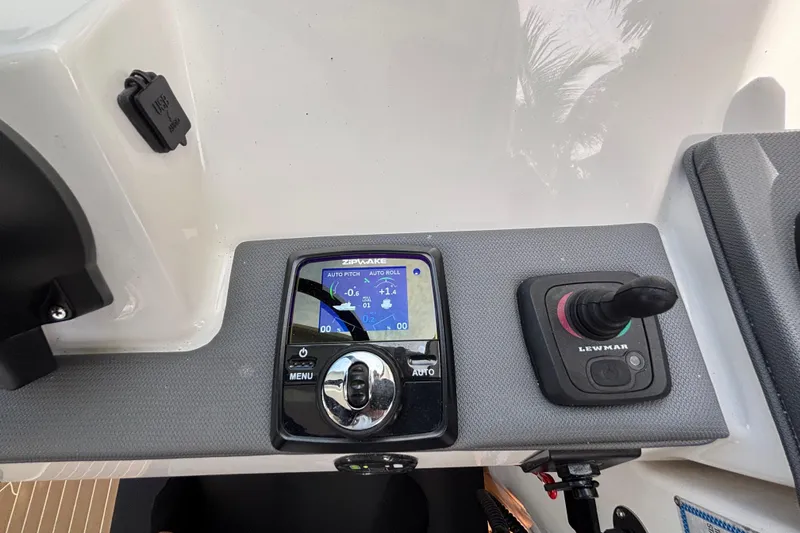 Slide: The Image of 2024 Pursuit OS 445 Offshore control panel with Zipwake and Lewmar systems. - 81