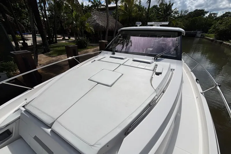 Slide: The Image of 2024 Pursuit OS 445 Offshore boat with spacious deck and sleek design. - 32