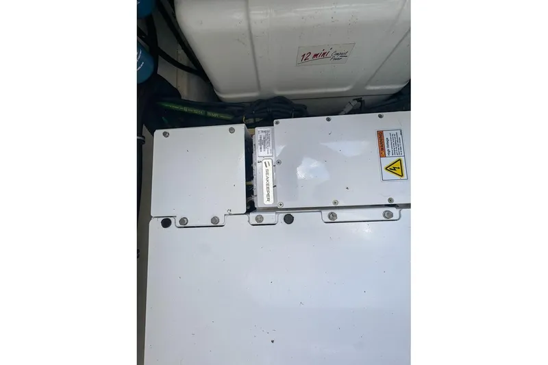 Slide: The Image of Engine compartment of 2024 Pursuit OS 445 Offshore boat with Seakeeper system. - 138