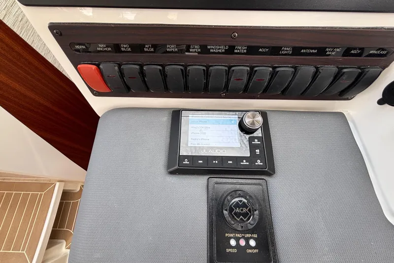 Slide: The Image of Control panel of 2024 Pursuit OS 445 Offshore boat with JL Audio system. - 80