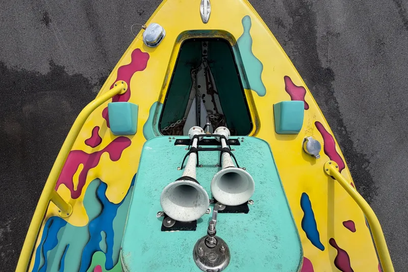 Slide: The Image of Colorful Apache 28 Splash boat, 2011 model, with vibrant abstract patterns and dual air intakes. - 73