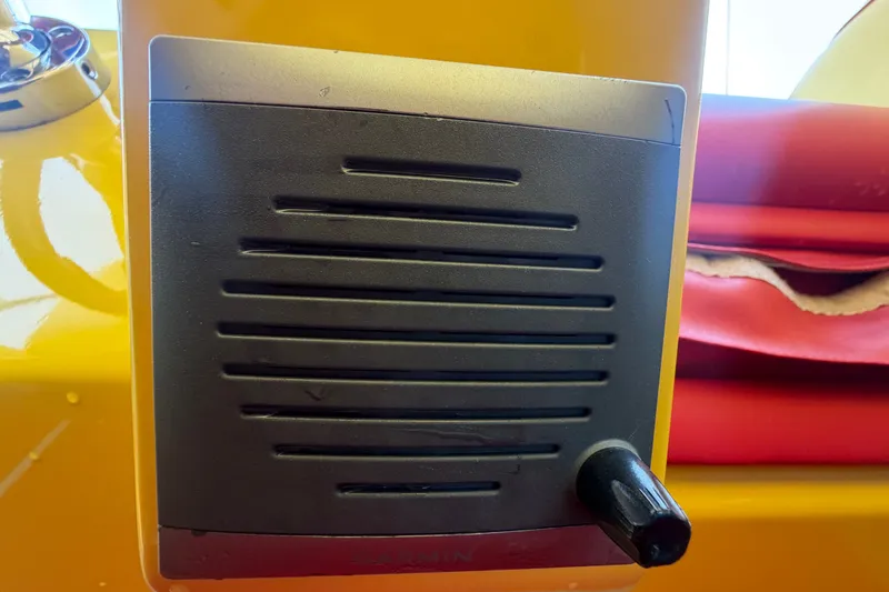 Slide: The Image of Close-up of a black vent panel on a 2011 Apache 28 Splash boat. - 40