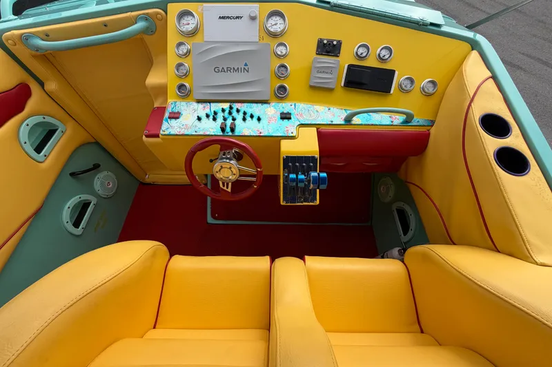 Slide: The Image of Colorful interior of a 2011 Apache 28 Splash boat with Garmin navigation system. - 22
