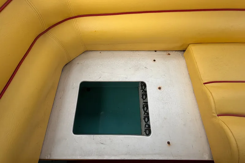 Slide: The Image of Yellow interior of 2011 Apache 28 Splash boat with window detail. - 92