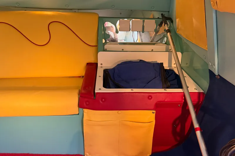 Slide: The Image of Interior of 2011 Apache 28 Splash with colorful seating and storage compartments. - 61