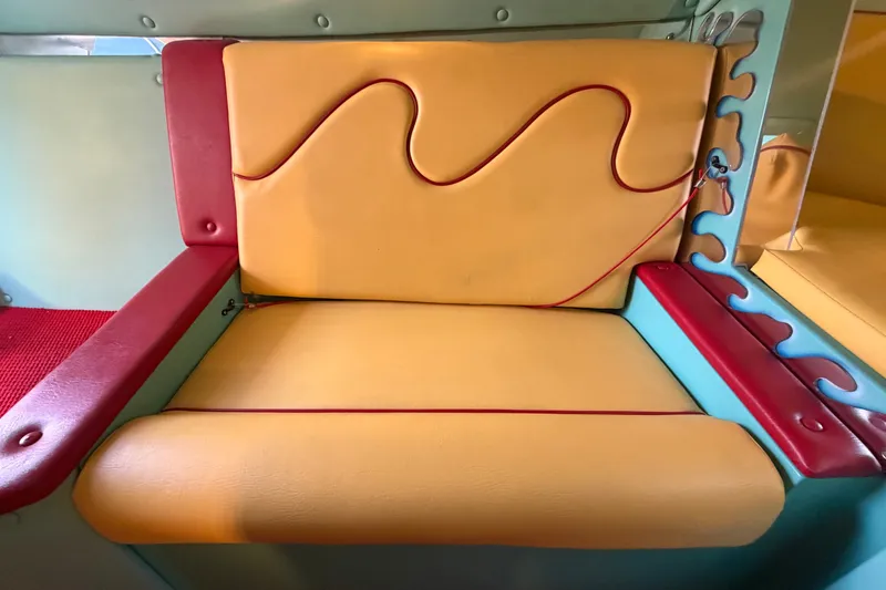 Slide: The Image of Colorful seat design in a 2011 Apache 28 Splash boat interior. - 48