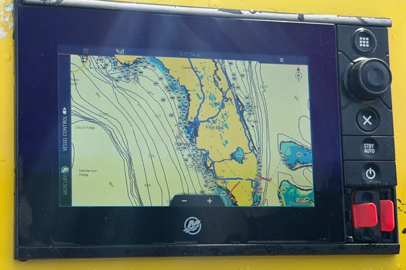 Slide: The Image of Navigation display on Apache 28 Splash boat, showing Florida coastline map. - 26