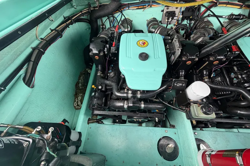 Slide: The Image of Engine compartment of a 2011 Apache 28 Splash boat, showcasing detailed mechanical components. - 97
