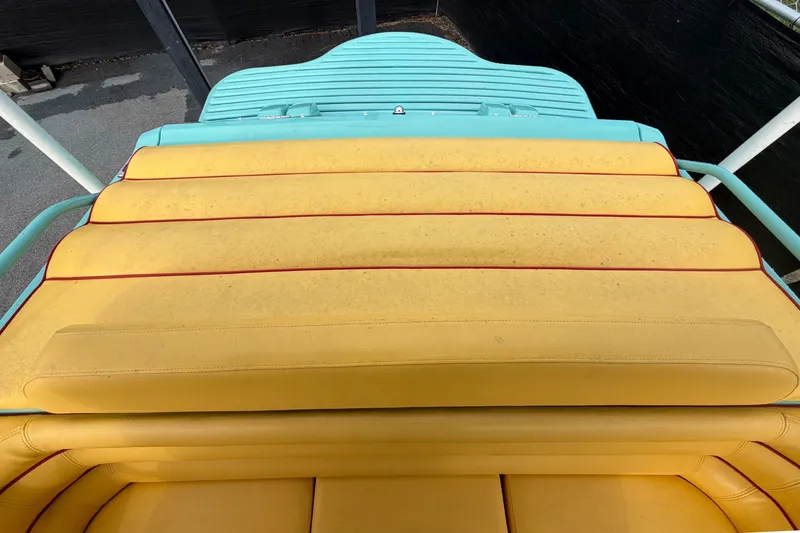 Slide: The Image of Yellow and turquoise seating on a 2011 Apache 28 Splash boat. - 94