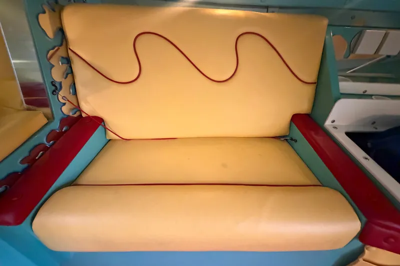 Slide: The Image of Yellow and red seat in 2011 Apache 28 Splash boat interior. - 58