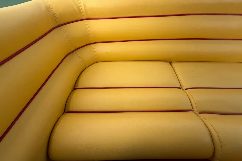 Slide: The Image of Yellow and red interior of 2011 Apache 28 Splash boat. - 91