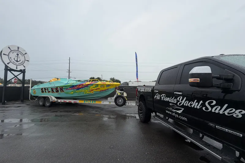 Slide: The Image of 2011 Apache 28 Splash boat on trailer, towed by All Florida Yacht Sales truck. - 4