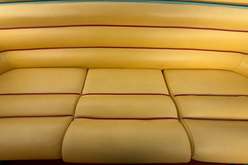 Slide: The Image of Yellow leather seat with red and blue accents, Apache 28 Splash 2011 model. - 88