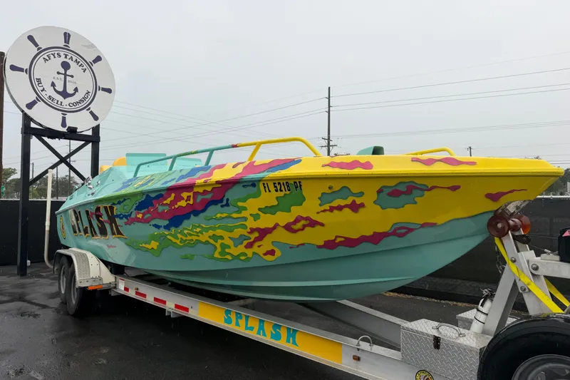 The Image of Colorful 2011 Apache 28 Splash speedboat on trailer at Aey's Tampa. - 0