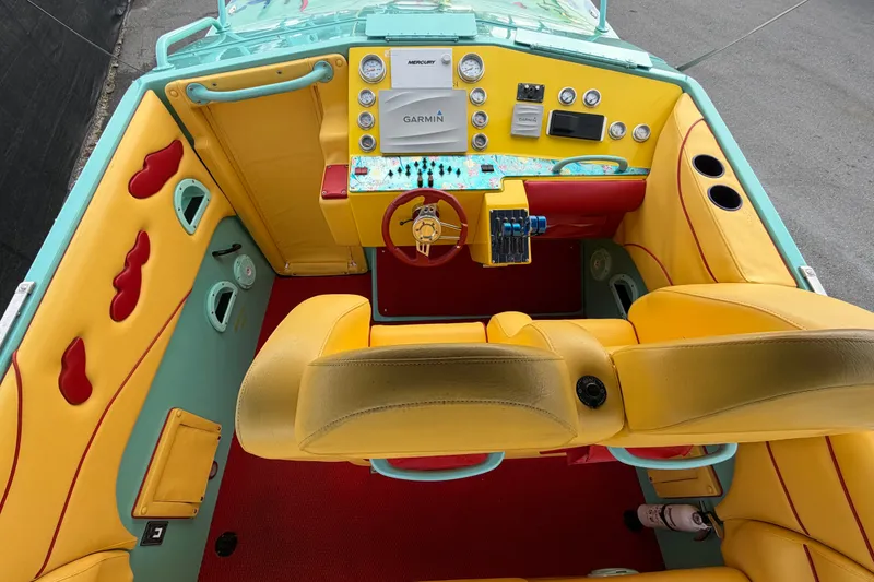 Slide: The Image of Colorful interior of a 2011 Apache 28 Splash boat with vibrant yellow and turquoise accents. - 20
