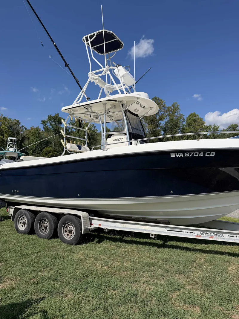 Slide: The Image of 2006 Century 2900 Center Console on a trailer, featuring T-tops and dual engines. - 2