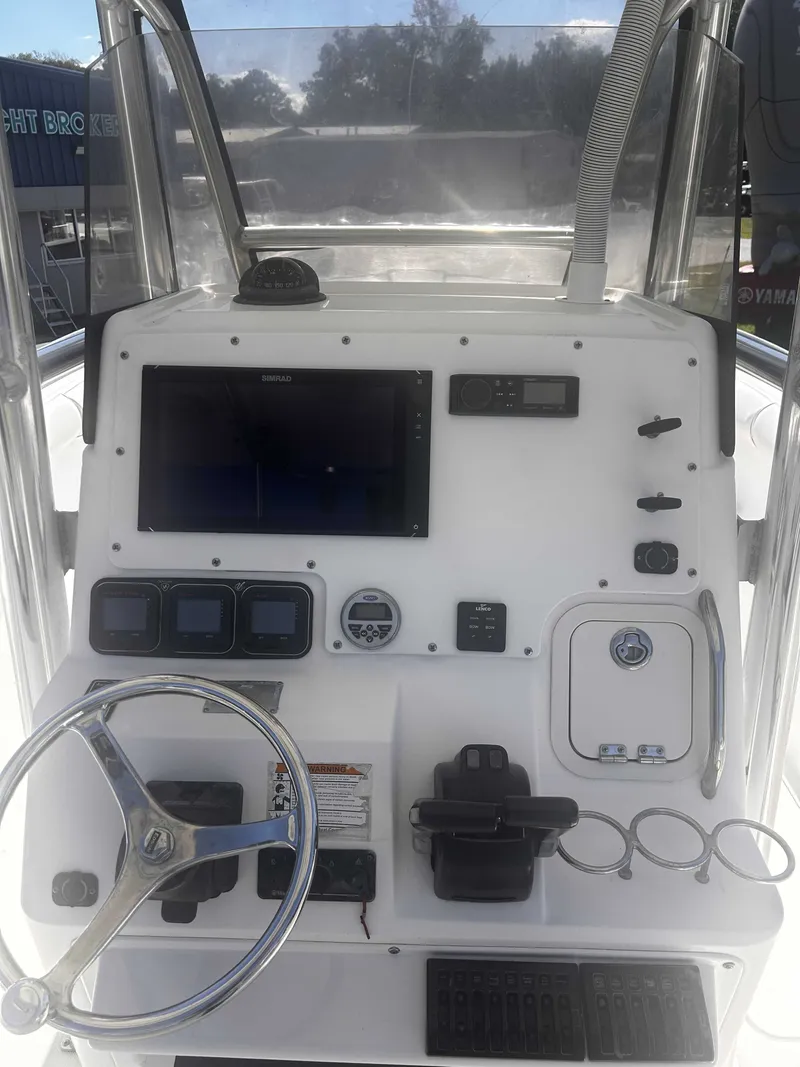Slide: The Image of The image shows the helm of a 2006 Century 2900 Center Console boat with modern instruments. - 5