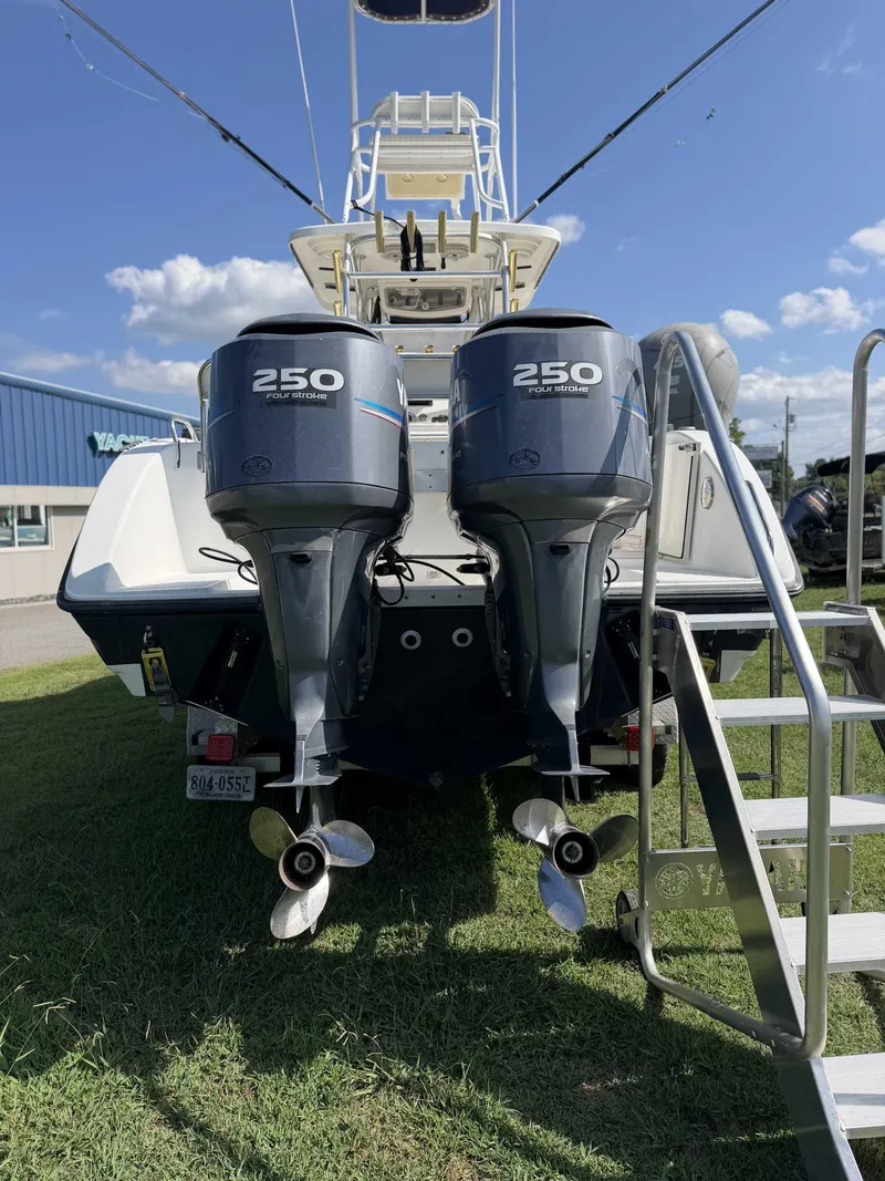 Slide: The Image of Rear view of a 2006 Century 2900 Center Console boat with twin 250 HP outboard engines. - 3