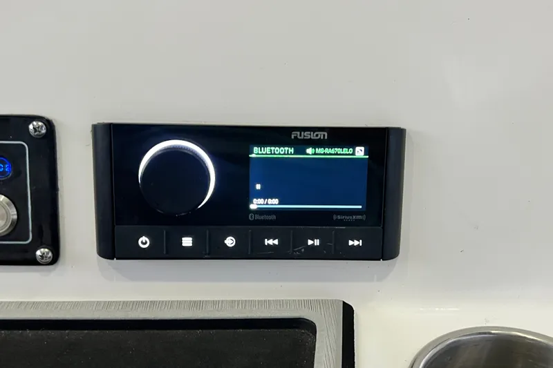 Slide: The Image of Fusion Bluetooth stereo system on 2024 Sea Fox 228 Commander boat dashboard. - 48