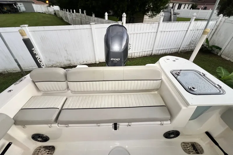 Slide: The Image of 2024 Sea Fox 228 Commander boat interior with seating and Yamaha 200 engine. - 49