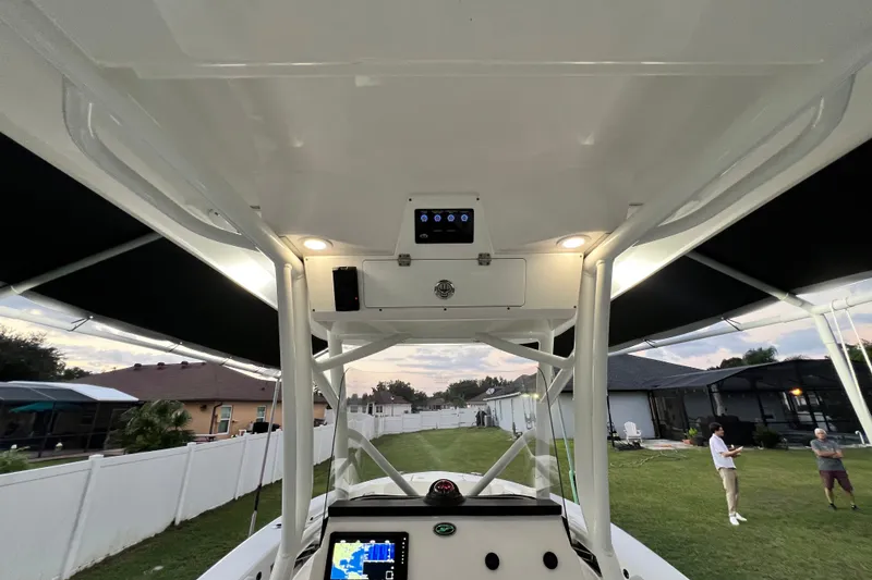 Slide: The Image of 2024 Sea Fox 228 Commander boat interior with advanced navigation system and overhead lighting. - 16
