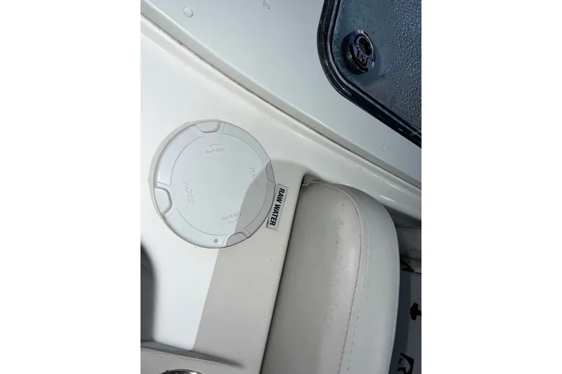 Slide: The Image of 2024 Sea Fox 228 Commander boat interior detail with hose access and seating. - 70