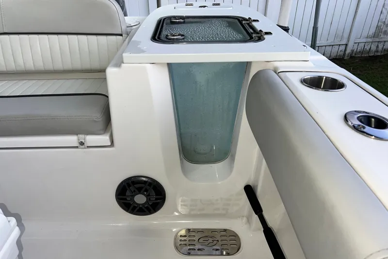 Slide: The Image of 2024 Sea Fox 228 Commander boat interior with seating, livewell, and cup holders. - 38