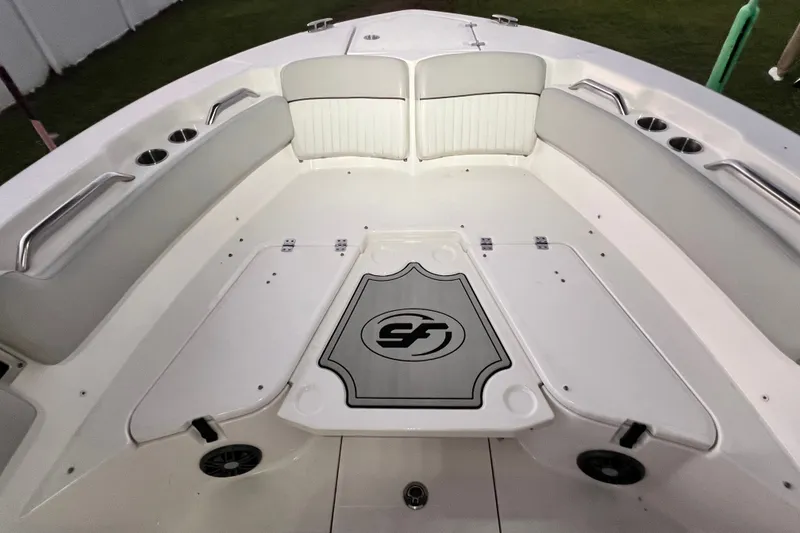 Slide: The Image of 2024 Sea Fox 228 Commander boat interior with cushioned seating and storage compartments. - 73
