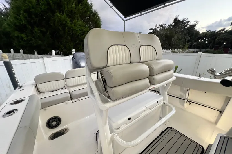Slide: The Image of 2024 Sea Fox 228 Commander boat interior with cushioned seating and console. - 50