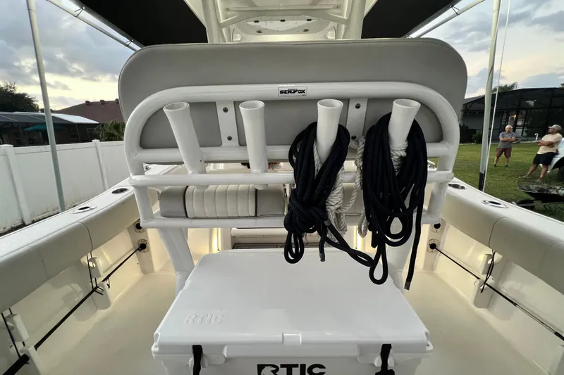 Slide: The Image of 2024 Sea Fox 228 Commander boat interior with rod holders and RTIC cooler. - 19