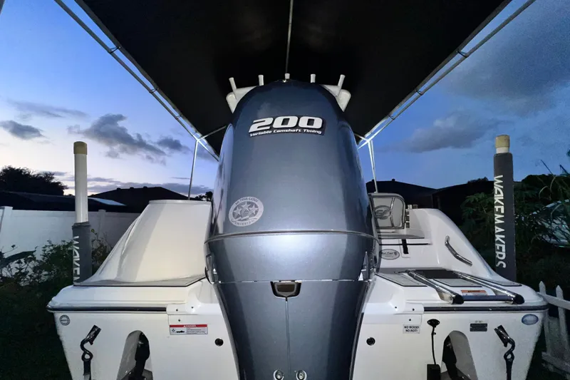 Slide: The Image of 2024 Sea Fox 228 Commander boat with 200 horsepower engine at dusk. - 8
