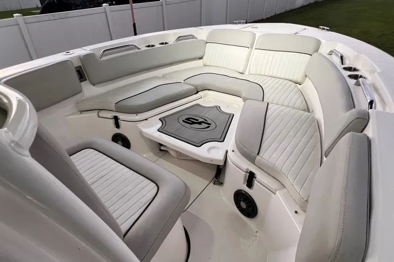 Slide: The Image of 2024 Sea Fox 228 Commander boat interior with cushioned seating and table. - 55