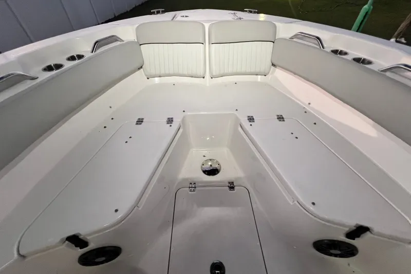 Slide: The Image of 2024 Sea Fox 228 Commander boat interior with cushioned seating and storage compartments. - 61