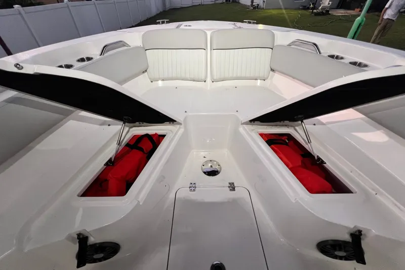 Slide: The Image of 2024 Sea Fox 228 Commander boat interior with open storage compartments and seating. - 72