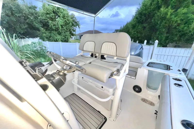 Slide: The Image of 2024 Sea Fox 228 Commander boat interior with helm and seating, showcasing modern design. - 36