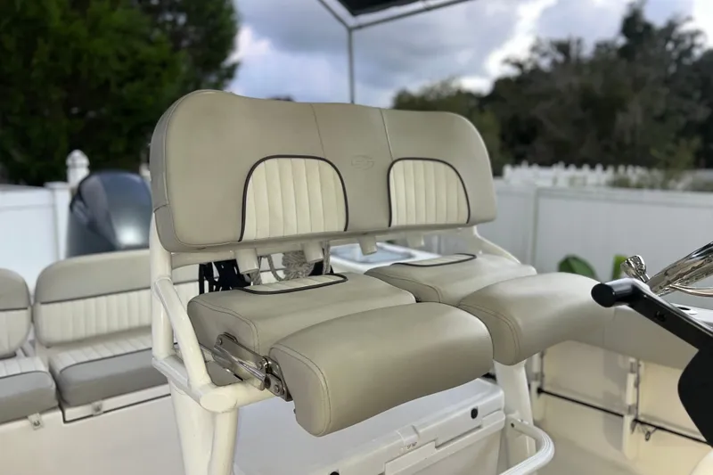 Slide: The Image of 2024 Sea Fox 228 Commander boat seating with beige upholstery and steering wheel. - 33