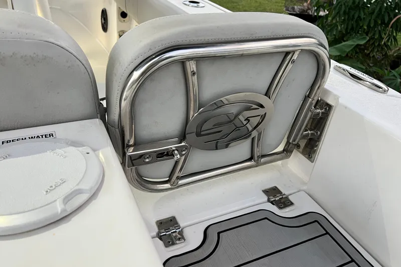 Slide: The Image of 2024 Sea Fox 228 Commander boat seat with stainless steel frame and logo detail. - 14