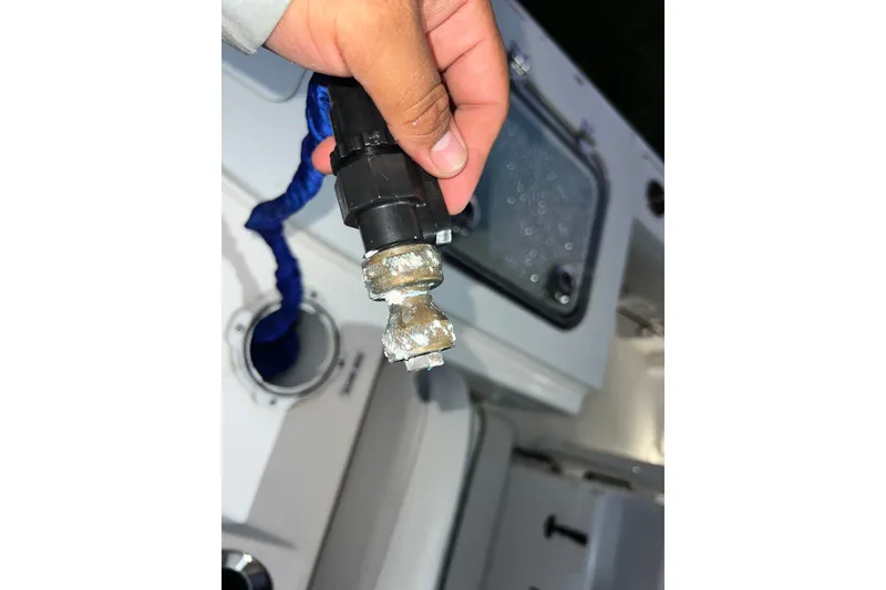 Slide: The Image of Hand holding a corroded fitting on a 2024 Sea Fox 228 Commander boat. - 71
