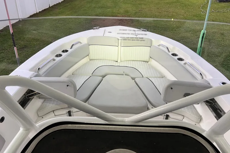 Slide: The Image of 2024 Sea Fox 228 Commander boat interior with cushioned seating and cup holders. - 44