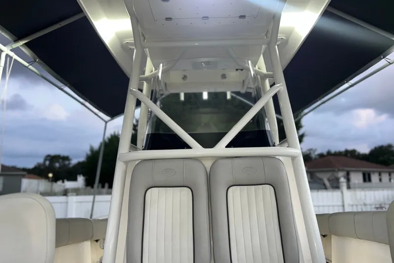 Slide: The Image of 2024 Sea Fox 228 Commander boat interior with cushioned seating and canopy. - 34
