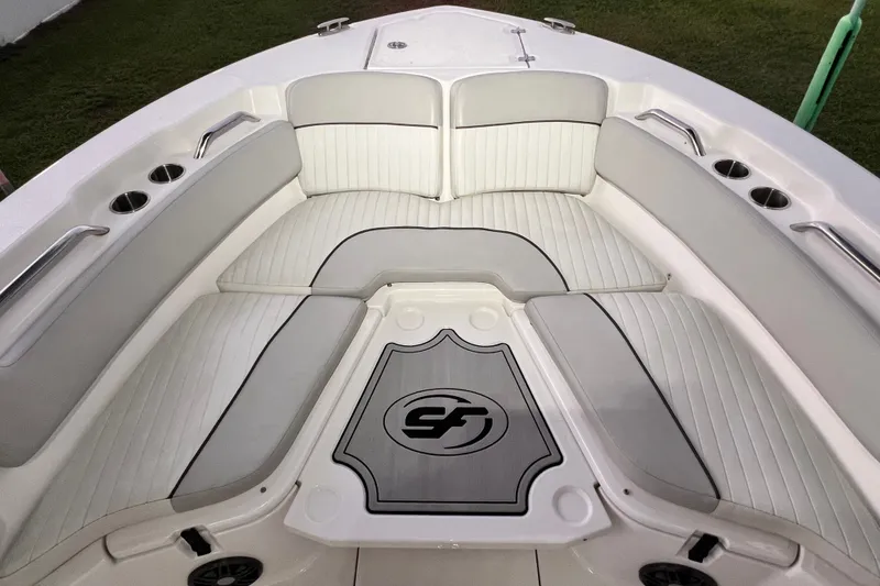 Slide: The Image of 2024 Sea Fox 228 Commander boat interior with cushioned seating and cup holders. - 56