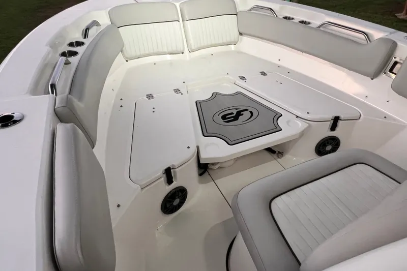 Slide: The Image of 2024 Sea Fox 228 Commander boat interior with cushioned seating and storage compartments. - 58